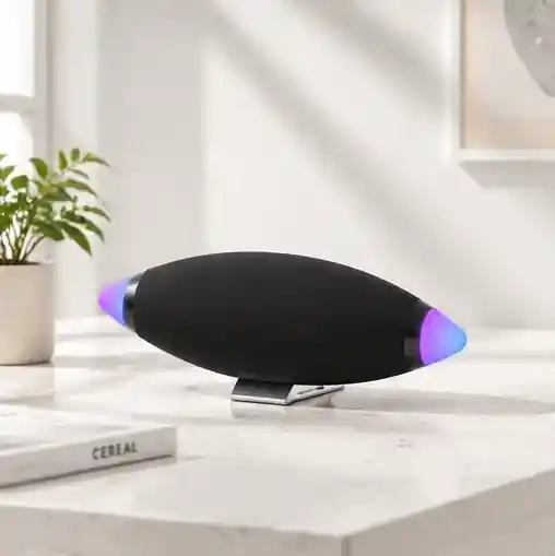 Black elliptical speaker on a white surface