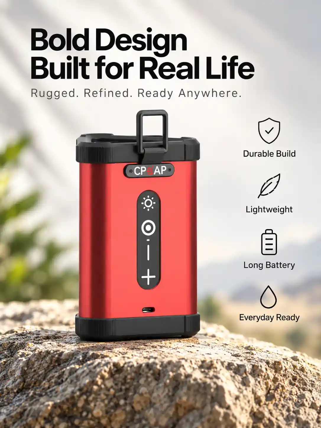 Red handled light speaker on a mountain rock